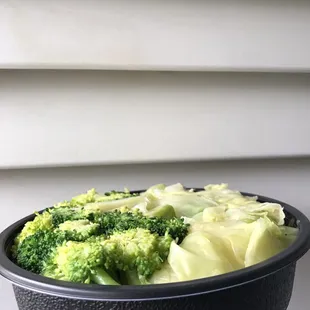 a bowl of broccoli and cabbage