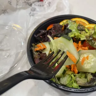 a salad in a bowl with a fork