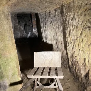 Tunnel to speakeasy within the cave.