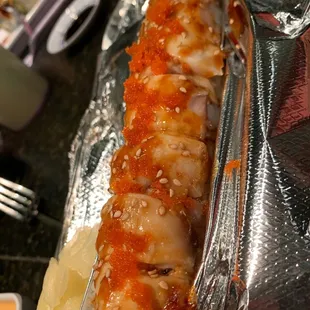 a close up of a roll of sushi