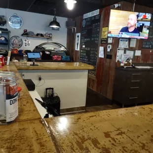 the tap list is a chalkboard in the corner by merch