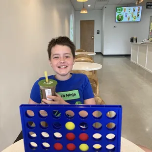 Playing Connect Four at Wada Boba.