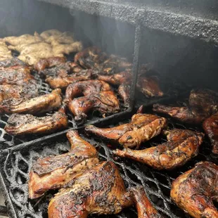 a grill full of grilled chicken