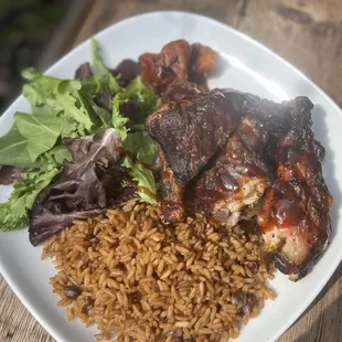 a plate of meat and rice