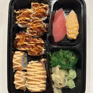 combo plate: salmon tuna roll, seared salmon nigiri, seaweed salad, spicy mountain roll, and tuna nigiri