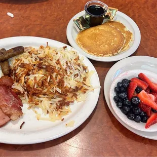 Hash browns,ham,bacon,and Sausage with pancakes and fruit. Not an egg eater.