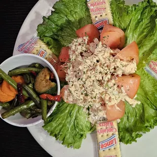 Lobster salad on tomato with side of veggies