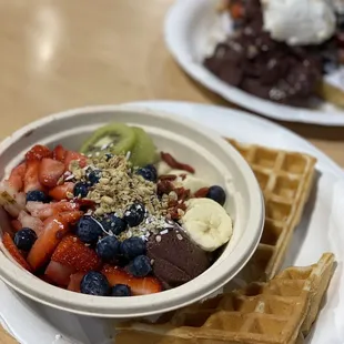 Açaí bowl, berries and cream waffle