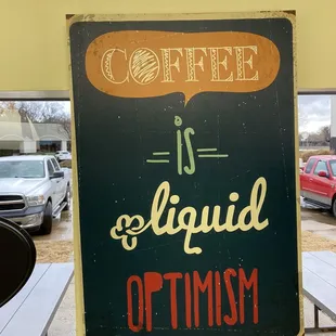 coffee art hanging in restaurant's main dining area