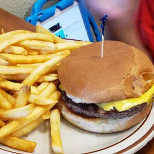 a hamburger and fries on a plate