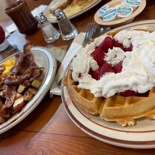 Combo #4 aka waffle with strawberry and country potatoes with bacon and eggs yum! &amp; the gf got country fried steak and eggs