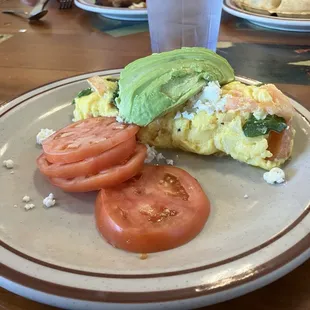 Feta spinach omelette with tomatoes and avocado
