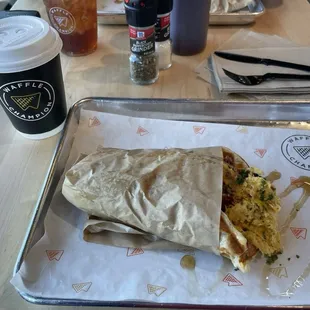 Bacon and egg waffle with syrup drizzle