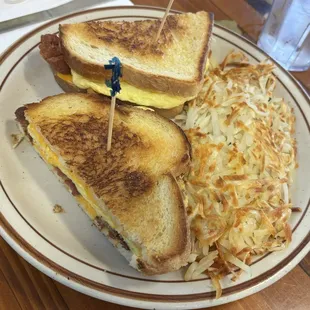 Special of the day egg-bacon-cheese sandwich with hash browns