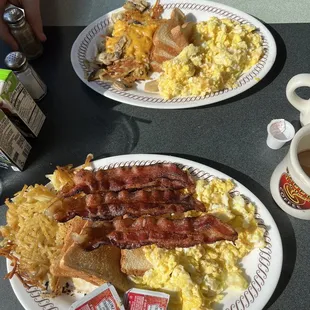 All star special +2 eggs (waffle on the way) &amp; two egg breakfast +4 eggs (bacon on the way) with hash browns capped and covered