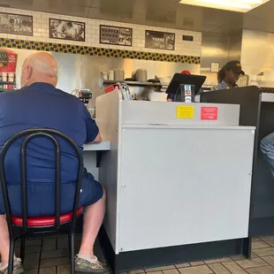 a man sitting at the counter
