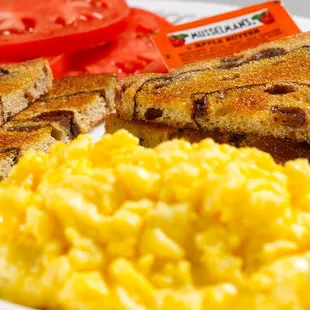 a plate of scrambled eggs and toast