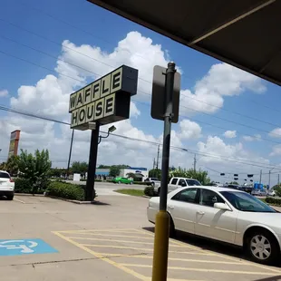 a white car parked in a parking lot