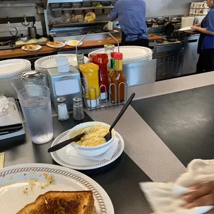 My Texas toast melt with egg and cheese! And my grits with cheese and butter and of the lovely staff working hard as usual!