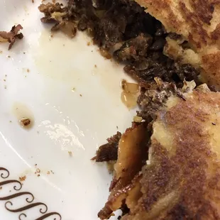 Cheesesteak sandwich. Over cooked meat, bread COMPLETELY soaked in oil!