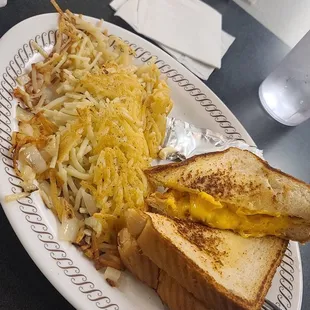 Egg &amp; Cheese Melt with Smothered Hashbrowns.