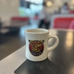 a coffee cup on a table