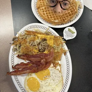 a waffle house breakfast with bacon, eggs, hash browns, and hash browns