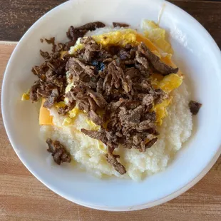 Grits, eggs, steak and cheese. Yummy