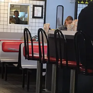 She is just standing there with headphones