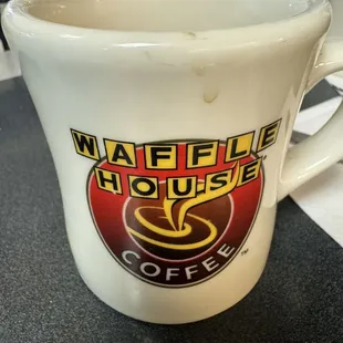 a coffee cup with a waffle house logo