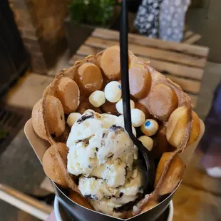 Delicious!  Fresh made bubble waffle with Reese&apos;s Pieces, cookie dough ice cream and birthday cake bites.