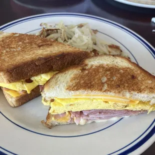 Moon Over Miami Breakfast sandwich. Ham, American Cheese, White American Cheese and scrambled eggs on sourdough bread.