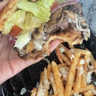 Mushroom Swiss Burger with added cheese to the fries. Huge portion for the price and well prepared