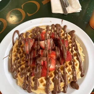 Waffle with fruit and chocolate (strawberries)
