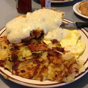 Chicken fried steak and eggs with home fries