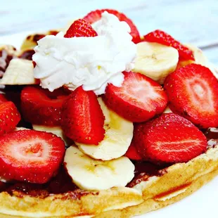 a waffle topped with strawberries and bananas