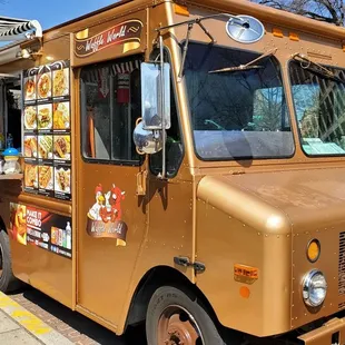 a food truck parked on the side of the road