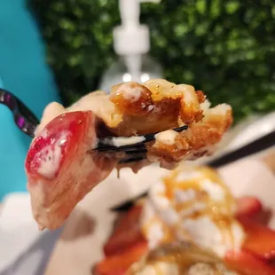 a waffle with ice cream and strawberries