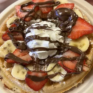 Breakfast Trio Oat waffle with fresh bananas, strawberries &amp; nutella