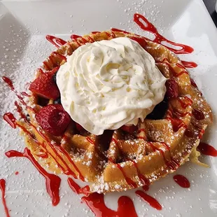Very Berry Waffle and a 3gg southwestern Omelet with potatoes, peppers and onions