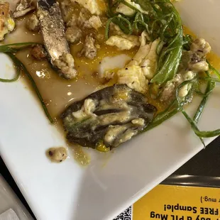 Possible bay leaf? Definitely was not in my country Benny. You can also see the watery syrup on her plate.
