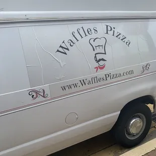 a van parked on the side of the road