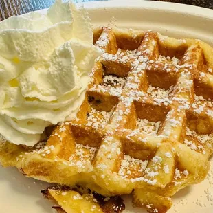 a waffle with whipped cream