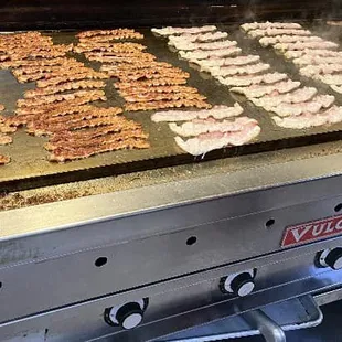 bacon cooking on a grill