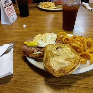 This is a Kill Bill, a breaded pork tenderloin with pepper jack cheese, ham, bacon, fried egg and chipotle mayo.