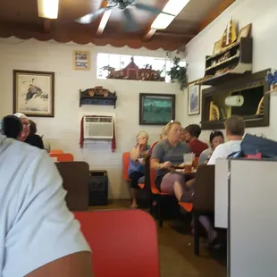 a man sitting at a table in a diner