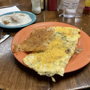 Spanish omelet, hash browns, and a side of biscuits and gravy