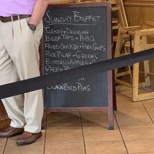 Sunday buffet menu board (tried to snap pic as walking in, sorry for the aisle strap)
