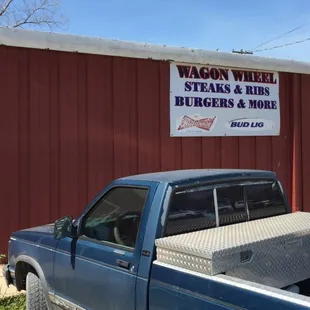 a truck parked in front of a building