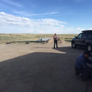 Charles fixing our tires with the beautiful view in the background